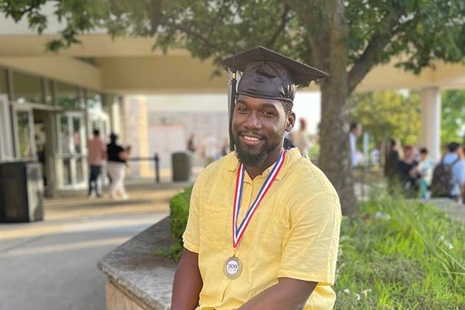 Jonathan M. outside at graduation